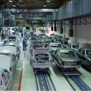 white car bodies on a factory line
